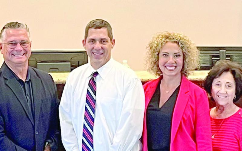 Council members take a photo with their staff during their final government meeting together. From left to right: Deputy Clerk of Council Jennifer Imbraguglio, Councilman District A Gillis McCloskey, Councilman District B Josh Moran, Councilman District C Howard Luna, Council-At-Large West Richie Lewis, Council-At-Large East Kerri Callais, Council Member District D Wanda Alcon, Council Member District E Fred Everhardt, Council Clerk Roxanne Adams, and Council Assistant Tonya Tabony.