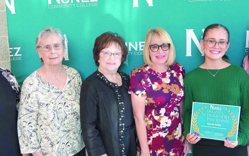 St. Bernard Volunteers for Family and Community (SBVFC) awarded the Maxine Wilson Scholarship to Nunez Community College student, Sarah Kelly. Shown presenting the $500 scholarship are VFC members Faye Shirley, Maxine Wilson, Nora Egan, Joan Garofalo, President, Sarah Kelly, recipient, and Dr. Tina Tinney, Chancellor, Nunez Community College.