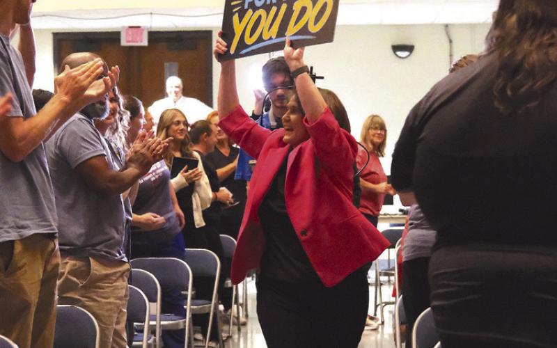 Superintendent Lumetta ran into the auditorium to kick o the event, holding a sign saying 'Thank you for all you do!'