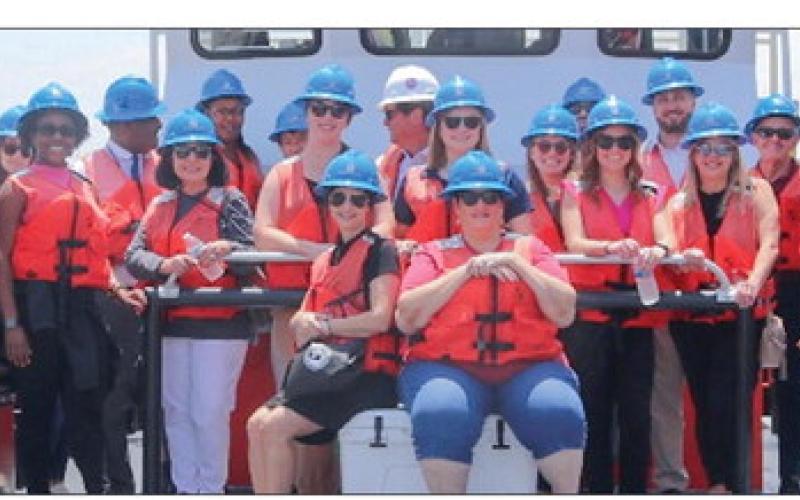 A group picture of the first tour group of attendees during the Maritime event.
