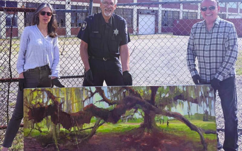 With a simple twist of faith Sabrina Schmidt, SBSO investigator Joe Delery, and Ford Motor Plant owner Sidney Torres get to hold the returned stolen art. To everyone's surprise, the painting was not damaged. You might suggest Sabrina got a pleasant dose of good karma.