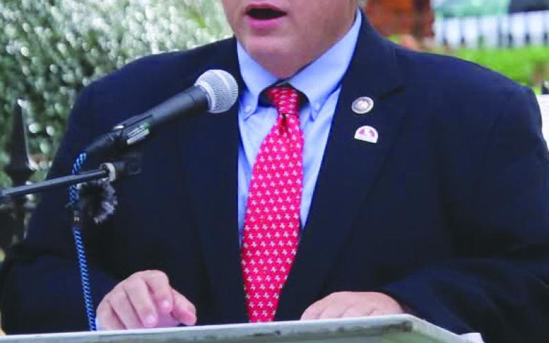 Rep. Bayham speaking at the British Memorial. Photo by Tony Peralta