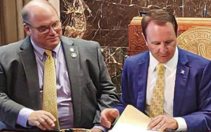 House Representative Mike Bayham gets first bill signed into law by Governor Jeff Landry.