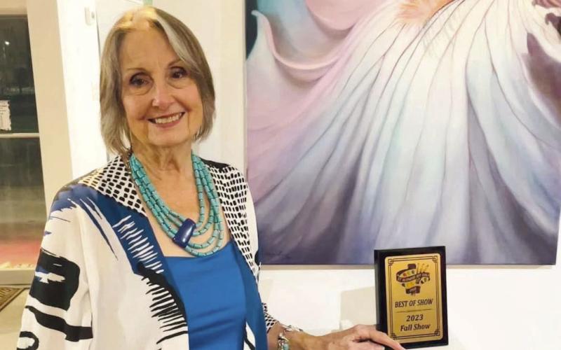 Presented by Ms. Rita Gue of the Meraux Foundation, the Best of Show Award went to artist Donna Lind (picutred) for her painting, Iris for Depth.