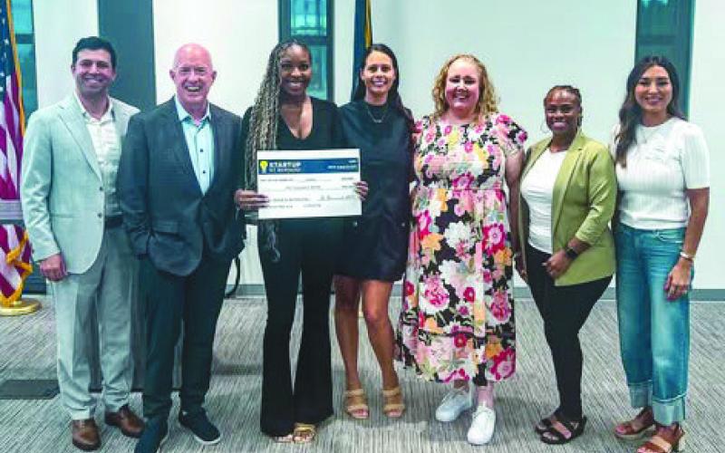 LimpiarOnline Representatives Accept Startup St. Bernard after winning the competition