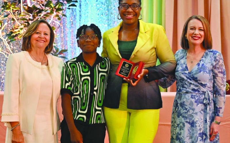 From left: Diana Dysart, Parent of the Year essayist Harvey Haynes, Markeda Haynes, Dr. Katherine Lemoine. Photo by Raymar Photography