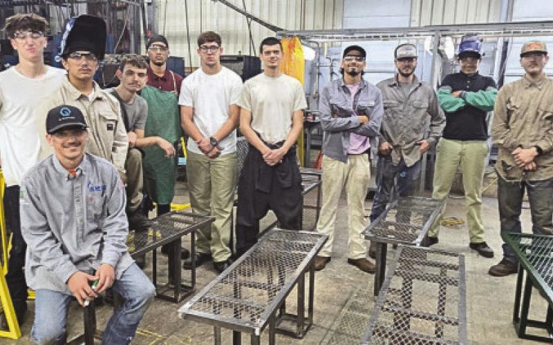 Nunez Welding Summer Internship students show o bike racks and benches they fabricated for St. Bernard Parish parks and trails. Each summer the Welding Summer Internship completes a public service project.