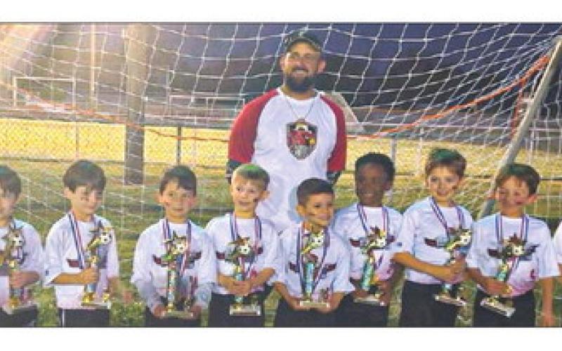 Versailles Cardinals were named 5/6-year-old Soccer Undeafted Champions with a 10-0 season record. Pictured, from left: Brady Moss, Zander Caballero, Rhett Sparnecht, Lance Taisant, Trenton Riggio, Martin Mustacchia,Charles Arrington, Hunter Wyatt, Ronnie Hebert and Jake Dysart with Head Coach Matt Taisant.
