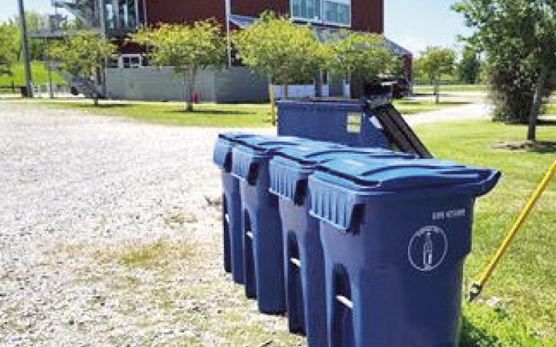 People are encouraged to deposit glass recyclables into the designated blue bins at Docville Farm Mondays through Fridays between 9 a.m. and 4 p.m.