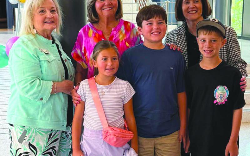Front row from left: Elle Fleetwood, Jack Dysart, and Quinn St. Amant; Second row from left: Maumus Center Director Carla Carollo, School Board President Diana Dysart, Superintendent Mary Lumetta.