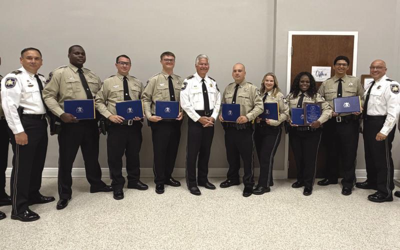 Seven St. Bernard Parish Sheri 's O ce deputies graduated May 5 from the Peace O cers Standards and Training, or P.O.S.T. School at the Slidell Regional Police Academy. At the graduation are, from left: Lt. Donald Johnson, Capt. Leander Morgan, graduates Dep. Derrick Stewart, Dep. Jack Stogner, Dep. Charles Migliore, Sheri James Pohlmann, Dep. Sheldon Prats, Dep. Shelbie Kuylen, Dep. Lytisha Ford, Dep. Anthony Pellerano, Capt. Stephen Ingargiola and Lt. David Culpepper.