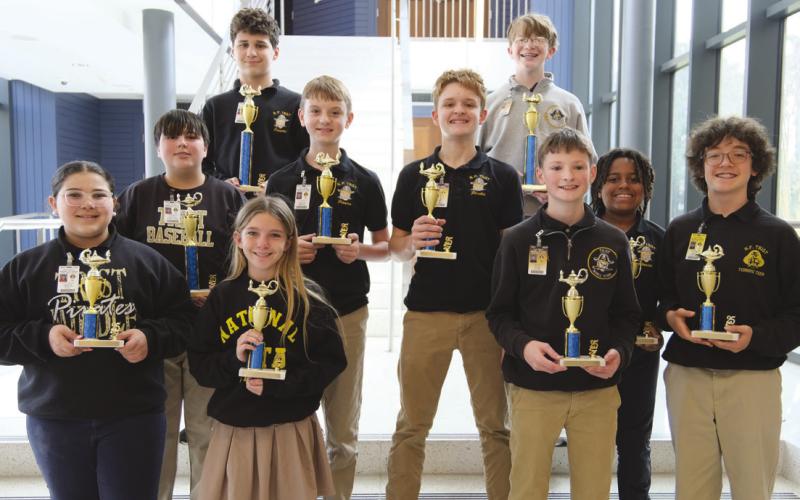 Elementary and Middle Divisions Teams, front row from left: Miriam Dali, Gracie Acosta, Tyler Bauer, Jonah Capstick. Middle Row: Grayson Caballero, Dominick Shreve, Micah Bastoe, Curtis Kass. Back Row: Luke Gagnard, Jack McMullin.
