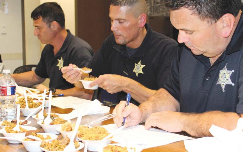 Judging some jambalaya for things like flavor and appearance are, from left: St. Bernard Sheri's Oce Maj. Justin Meyers, Maj. Chad Silcio and Sgt. Jerey Babin.