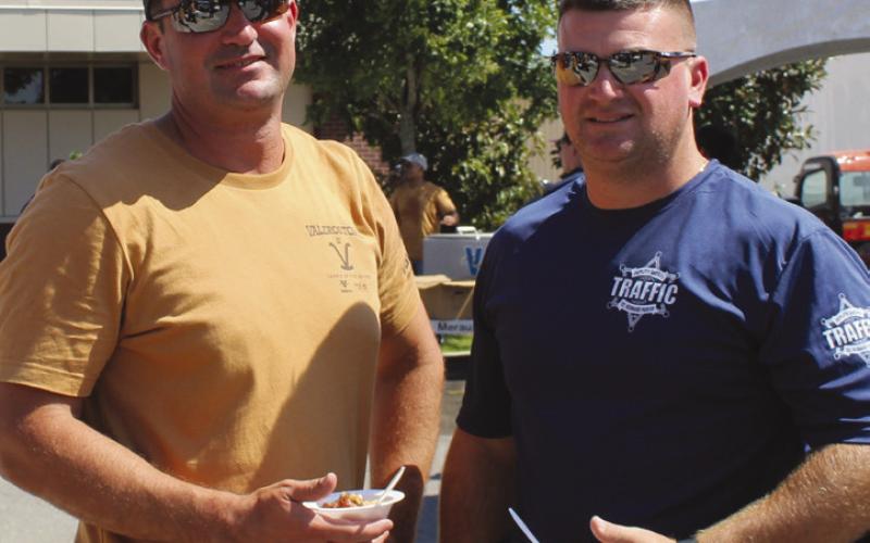 St. Bernard Sheri's Oce Trac Division Sgt. Christopher Manno, right, stopped by to support the annual Jambalaya and Gumbo Cook-O. With Sgt. Manno is Philip Ramos, Valero Meraux's senior refinery inspector.