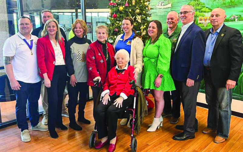 Operation Merry Christmas Board Members Present Checks to Local Charitable Organizations