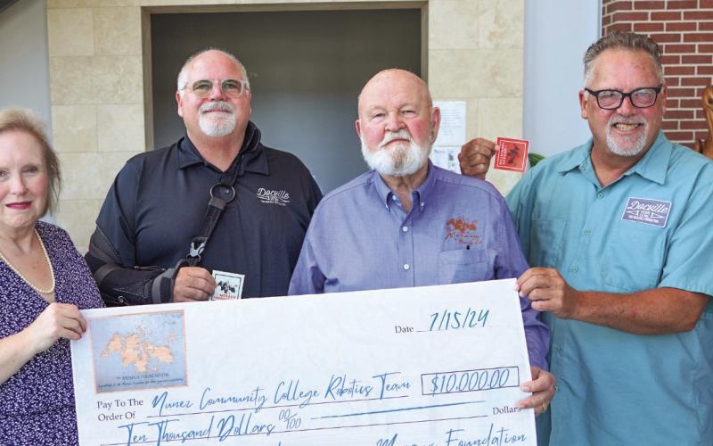 Pictured from left are Director of Development Paige Davis, STEAM Director Dr. Julie Rexford, Meraux Board Members Bill Haines, Floyd Gue and Chris Haines, and Associate Vice Chancellor of Institutional Advancement Katherine Lemoine.