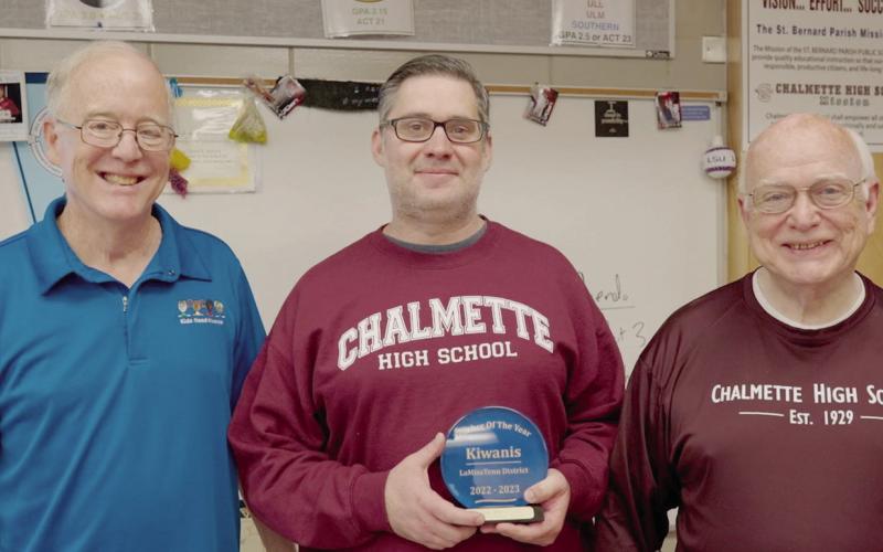 Pictured with 2022-2023 St. Bernard Parish High School Teacher of the Year David Bellard (center) is Kiwanis President Mike Pechona and CHS Principal Wayne Warner.