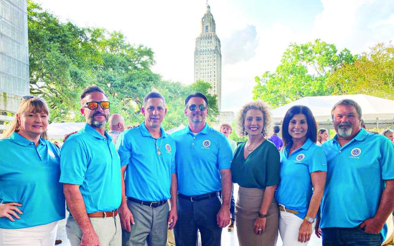 Council Assistant Tonya Tabony, District B Council Member Josh Moran, Council Member At Large West Richie Lewis, District A Council Member Gillis Mccloskey, Council Member At Large East Kerri Callais, Clerk of Council Roxanne Adams, and District E Council Member Fred Everhardt Jr. pose for a photo during St. Bernard Day at the Capitol.