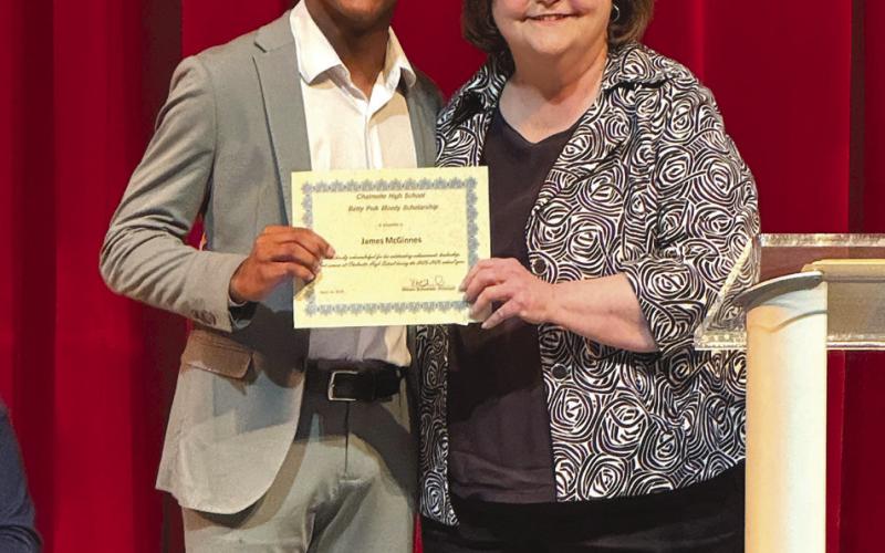 Betty Polk Moody Musical Scholarship recipient James McGinnis and Superintendent Doris Voitier.