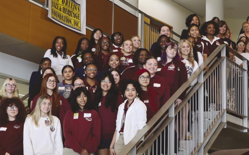 Students take a group picture after the St. Bernard Chamber of Commerce’s Women’s Professional Network Mentoring Session at Chalmette High School.