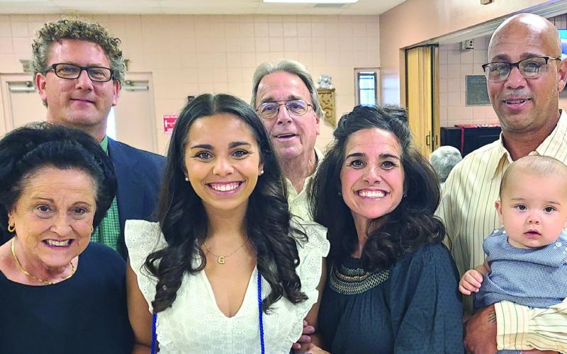Gabby Glapion Abadie, a third grade teacher in St. Bernard Parish, was recently honored as an Outstanding Master's Graduate in K-12 EducationalAdministration by the University of New Orleans. Abadie (first row, second from the left) said being honored in front of her family made the award even more special.