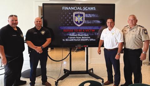 Col. Chad Clark, commander of the St. Bernard Parish Sheri 's O ce Criminal Investigations Bureau, third from left, and Assistant Commander Capt. Ryan Melerine, second from left, speak to members of the Old Arabi Neighborhood Association during a recent community meeting at the Maumus Center, where they share information about current scams targeting residents and how to avoid becoming victims. Also pictured are Detective Lt. Robert Garofalo, far left, and Lt. Eric Eilers, far right.