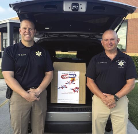 Col. Daniel Bostic Jr., commander of the Special Investigations Division, left, and Lt. Cliord "Chip" Englande of the SID Narcotics Unit, participated in the National Prescription Drug Take-Back Day held Saturday, Oct. 25 where the Sheri's Oce collected 55 pounds of