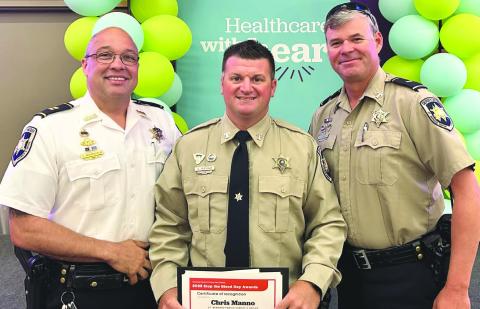St. Bernard Sheri's Oce Dep. Christopher Manno, center, was recently honored by University Medical Center New Orleans' Trauma Program during a Lifesaving Recognition Service. With Dep. Manno are: Capt. Stephen Ingargiola, director of training, left, and Lt. Brent Bourgeous of the Trac Division.