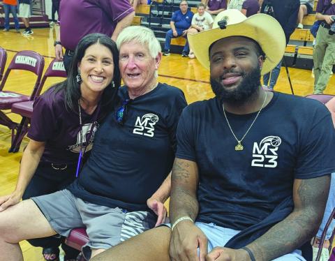 CHS Assistant Principal Kelli Watson with Coach Butch Stockton and Knicks player Mitchell Robinson.