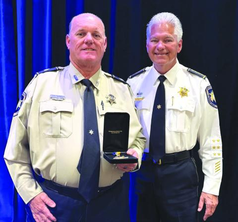 St. Bernard Sheri James Pohlmann, right, stands with Detective Sgt. Kenneth Sierra during the 41st Annual Crimestoppers of Greater New Orleans Awards Luncheon, where Sgt. Sierra was recognized as one of the region's 2026 Deputies of the Year.