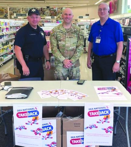 From left: Special Investigations Division Narcotics Agent Lt. Cli ord "Chip" Englande, Sgt. Barry Sevin with the National Guard Counter Drug Program, and Walgreens Manager Kevin Krul.