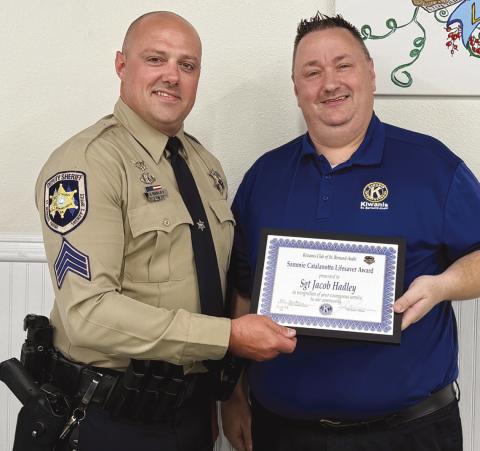St. Bernard Parish Sheri 's O ce Sgt. Jacob Hadley, left, is presented with the Kiwanis Club of St. Bernard Sammie Catalanotto LifeSaver Award by Kiwanian Ellis Fortinberry.