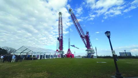 Associated Terminals’ “D. Lopez” and “Bill S.” cranes, newly christened January 22 at Woldenberg Park in New Orleans.