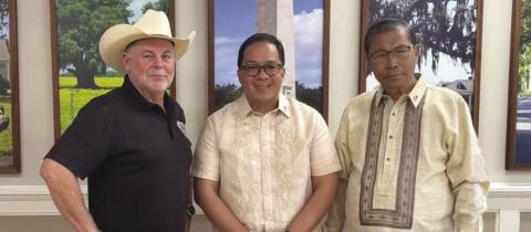(From left to right) Parish president Louis Pomes, Consul General Gunther Emil M. Sales, and Deputy Consul General Robert Romero pose for a photo during the General Consul’s visit to the parish.