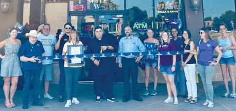 Council members Patrice Cusimano and Ryan Randall, representatives from the Parish President's Oce, the St. Bernard Chamber of Commerce, and community members join owner Shade Ahmad and Royalty Discount employees to cut the ribbon and celebrate the store's grand opening on Judge Perez Drive.