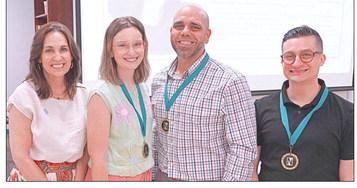 Three of Nunez Community College's top instructors were recognized April 30 during the college's annual Excellence In Teaching Luncheon. Pictured from left are Nunez Chancellor Tina Tinney with nominees Melanie Schmill, Steve Baiamonte and Charles Miller.