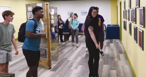 Nunez Community College opened its Los Isleños Historical Archive Aug. 27 with an open house for special invited guests. The archive is open and available to the public on the second floor of the Nunez Library. Pictured, Nunez instructor Taylor Amalfitano leads her class through the archive.