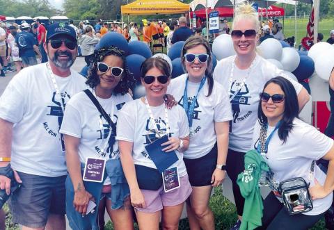 Community Center of St. Bernard's Board Members and sta enjoying the post-race afterparty at the 2024 Crescent City Classic. Photo Credit: Lori Noto