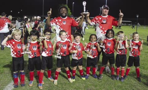 Coaches: Ronnie Campbell (left), Elliot Gerhold (right); Team (from left): Graham Gerhold, Santiago Montoya, Pablo Montoya, Beaux Hebert, Cooper Hebert, Knowledge Claverie, Jaleel Campbell, Justin Duhon, Liam Alvarez.