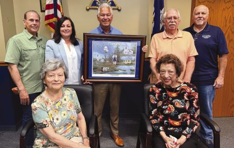 Seated from left: Lena Nunez, Society president, and Janice Crespo-Smith, Society vice president. Standing from left: Joey DiFatta, Society member; St. Bernard Parish Assessor Jaylynn Bergeron Turner, Society member; Sheri James Pohlmann; Bob Smith, Society member; and Jimmy Faust, Society director.