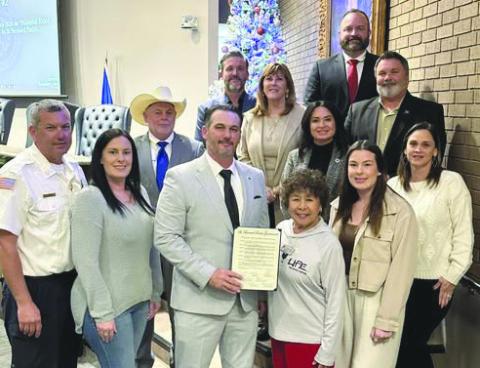 Representative with The Blood Center Suzie Potter accepts Proclamation naming January 2026 National Blood Donor Awareness Month in St. Bernard from council member and parish president Louis Pomes.