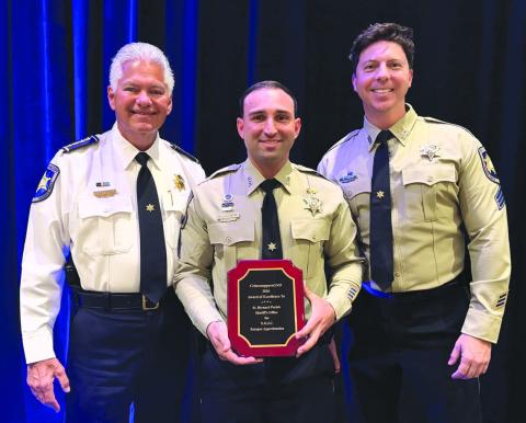 St. Bernard Sheri James Pohlmann, left, stands with Special Investigations Division Sgt. Richard Scheuermann, center, and Sgt. Jonathan Smith, right, after they were honored at the 41st Annual CrimestoppersGNO Awards Luncheon for their partnership in handling anonymous tips that developed into critical intelligence assisting in the arrest of Orleans Parish Prison escapees.