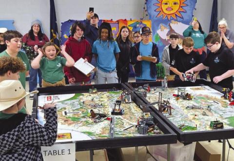 Students from Nunez Community College Robotics Team 57245, in black, and Our Lady of Prompt Succor (OLPS) School’s Patriots, in green, participate in the college’s inaugural FIRST LEGO League Tournament in December 2025. Three Nunez teams and OLPS advanced to state competition in February at Jesuit High School.