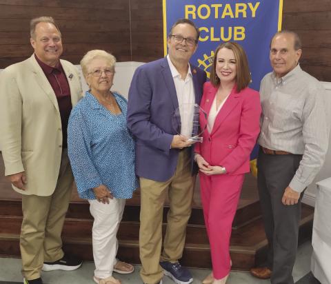 Rotary Board Members Sean Warner, Brenda Break. eld, and Joey DiFatta recognize Dr. Katherine and Barry Lemoine for their service to St. Bernard Parish.