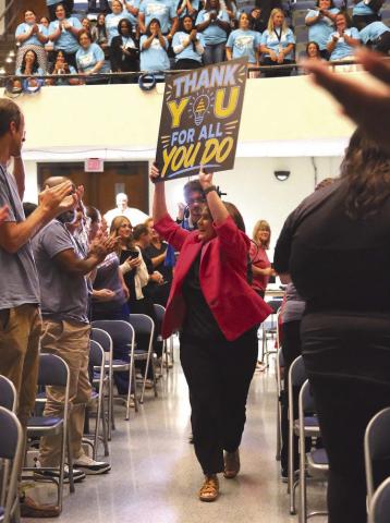 Superintendent Lumetta ran into the auditorium to kick o the event, holding a sign saying 'Thank you for all you do!'