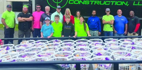 On Point Construction owners, employees and their children have been hand delivering Thanksgiving baskets throughout St. Bernard Parish to families in need for the past seven years.