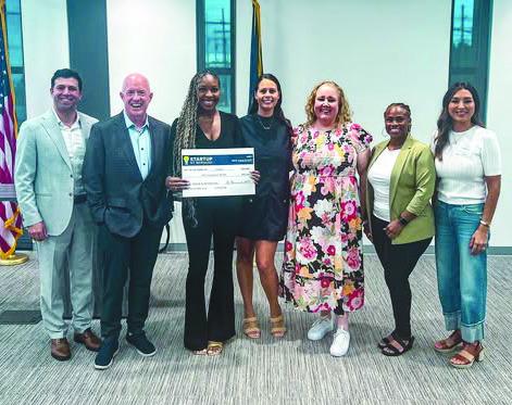 LimpiarOnline Representatives Accept Startup St. Bernard after winning the competition