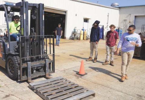 Nunez Instructor Jesús Melendez leads a forklift certi. cation class on the Nunez campus. Forklift is one of 8 equipment certi. cations and . ve workplace certi. cations available through Nunez's six-week Heavy Equipment program.