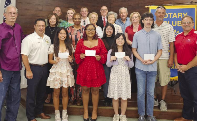 Members of the Rotary Club of St. Bernard pose with this year's scholarship recipients from Chalmette High and their family members during the club's scholarship presentation. Scholarship recipients are Lillian Lai, attending the University of Texas; David England, attending the University of Texas; Celine Bioc, attending the University of Notre Dame; and Destiny Bullock, attending the Massachusetts Institute of Technology.