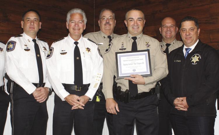 St. Bernard Sheri's Oce Dep. Gabriel "Trip" Roques III receives the prestigious Kiwanis Club of St. Bernard Sammie Catalanotto LifeSaver Award. At the award ceremony are, from left: Col. Daniel Bostic Jr., Capt. Leander Morgan, Sheri James Pohlmann, Sgt. Mitchell Perkins, Dep. Roques, Sgt. Matthew Chiasson, Col. Chad Clark and Capt. Ryan Melerine.